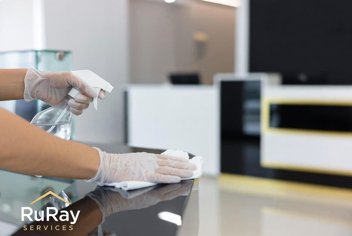 RuRay Services team cleaning an office reception desk
